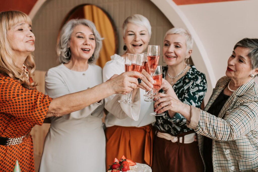 a-group-of-elderly-women-clinking-glasses-7561105 A Group of Elderly Women Clinking Glasses