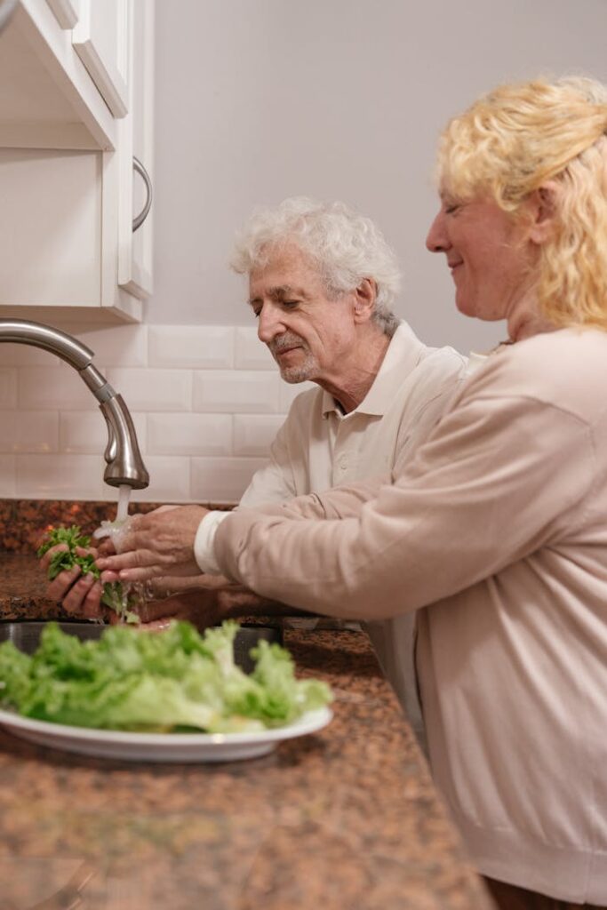 elderly-couple-washing-green-vegetable-together-8805504 Elderly Couple Washing Green Vegetable Together